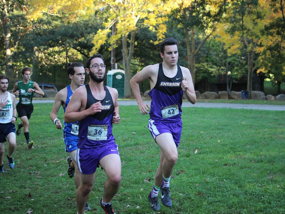 Men's cross country runners on trail