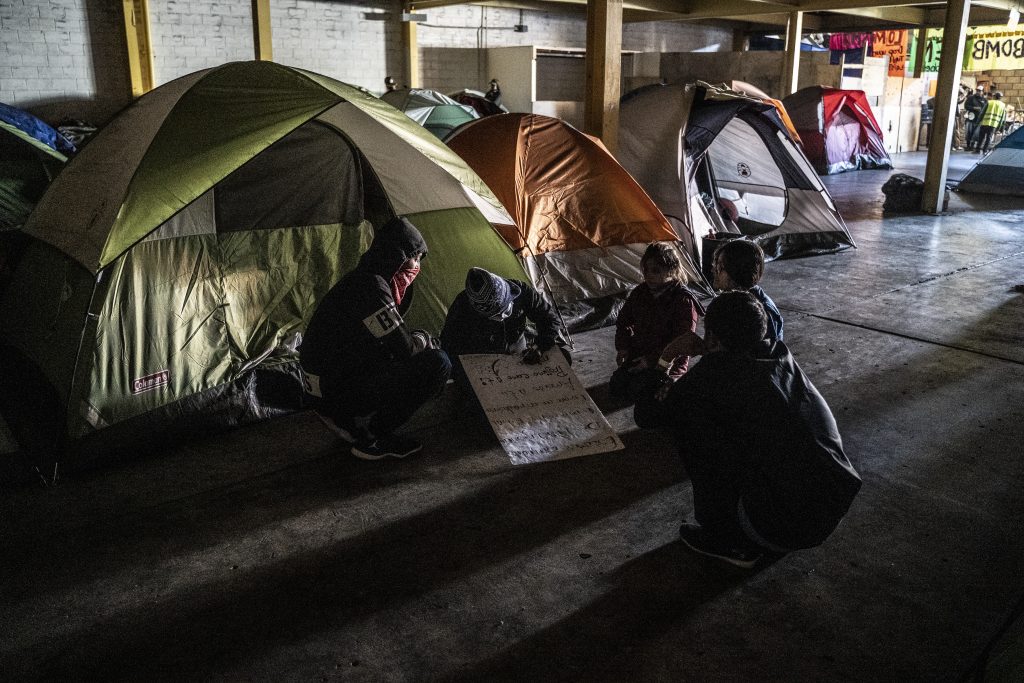 Immigrants have set up tents in a migrant shelter in Tijuana.