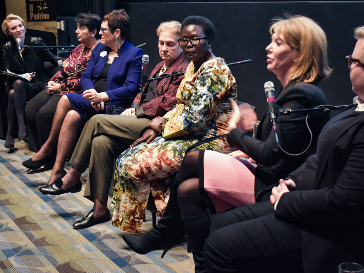 Seven women sit on panel