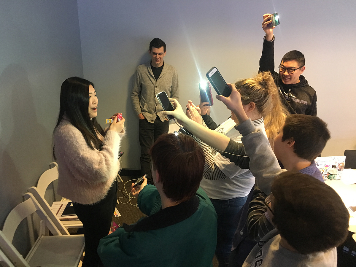 students take video of woman with phones