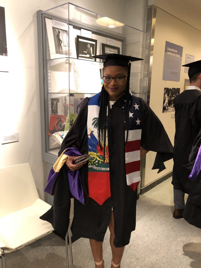 Wesline Zolfonoon wears an academic stole representing being a Haitian-American.
