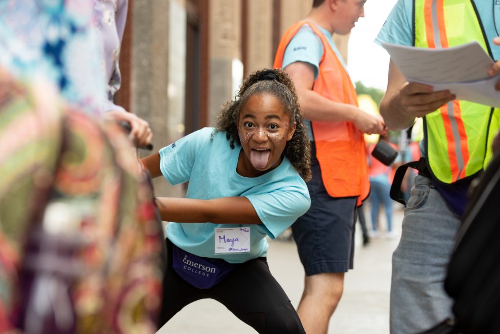A student sticks her tongue out at the camera