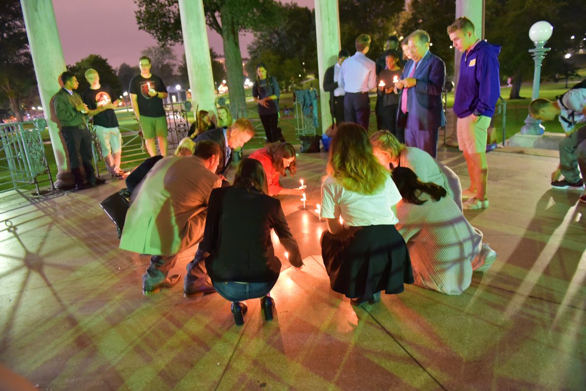Students light candles at 9/11 vigil