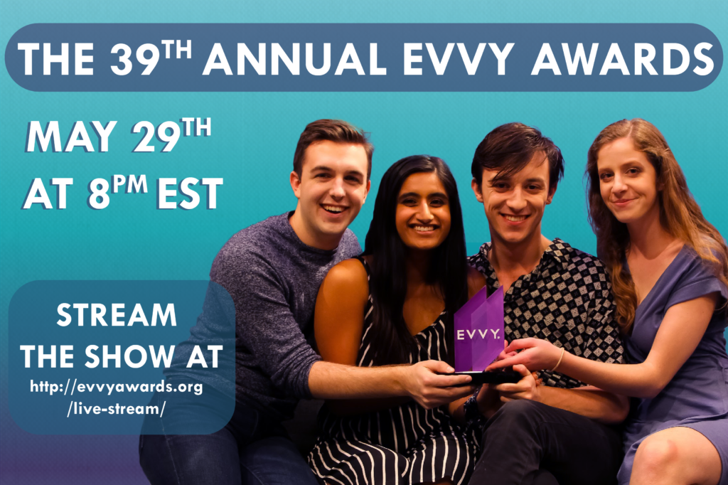 Four people smile while holding an EVVY Award