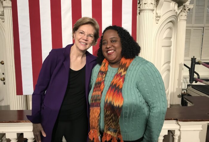 Two women stand next to each other