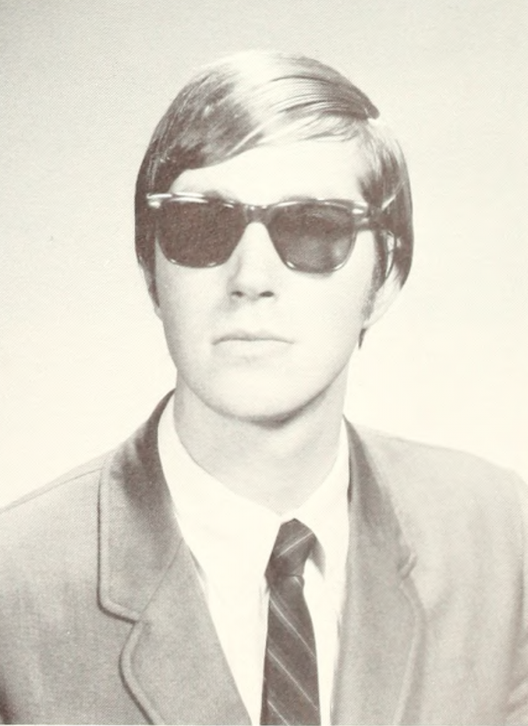 Headshot of man wearing sunglasses