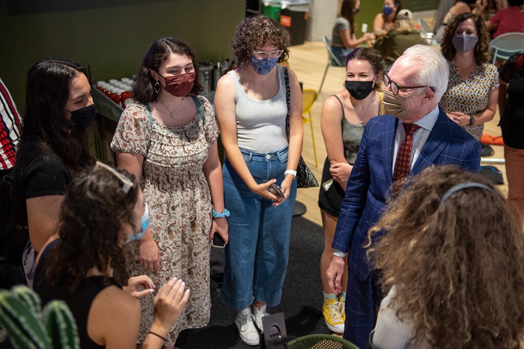 Tim Gunn surrounded by students