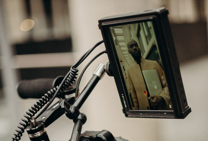 image of black man on film camera viewing panel