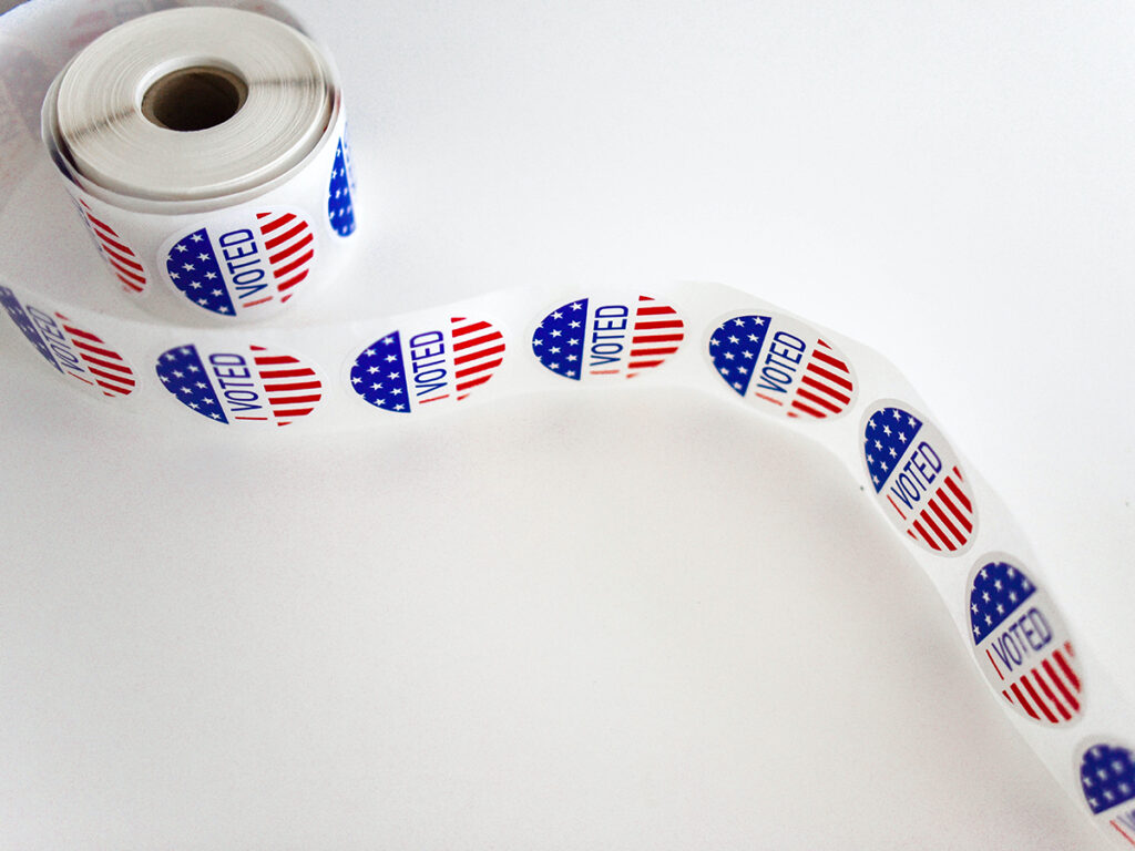 unfurled roll of "I voted" stickers