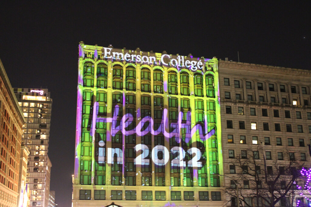 Little Building facade illuminated green with words "Health in 2022"