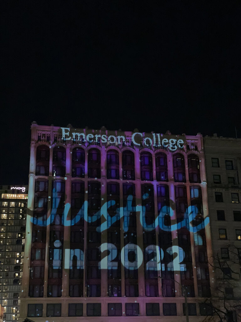 Little Building facade illuminated with words "Justice in 2022"