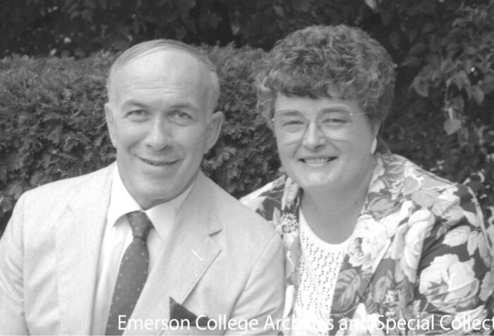black and white photo of Jim and Jean Peckham in front of hedge