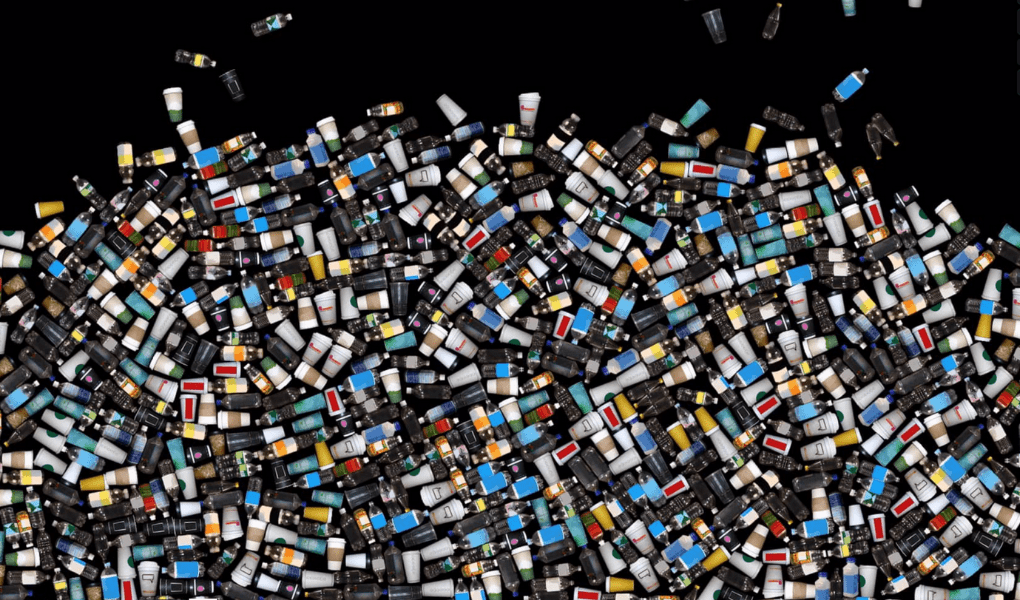 Hundreds of CGI-generated plastic bottles are splayed across a black background