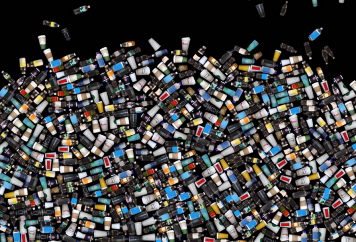 Hundreds of CGI-generated plastic bottles are splayed across a black background.