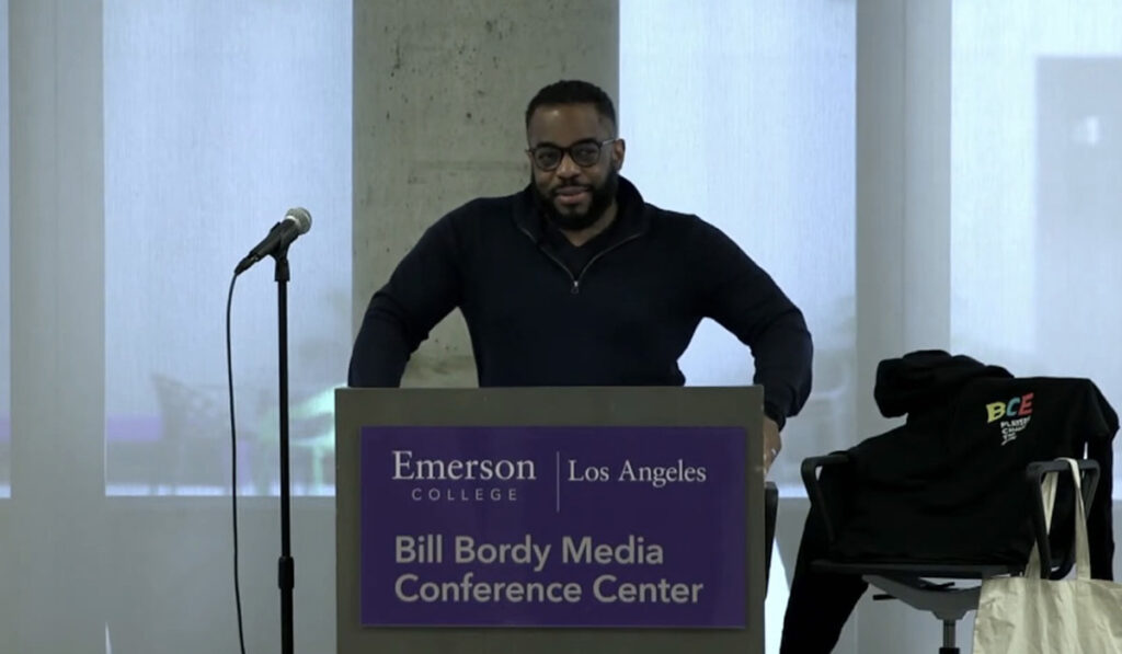 Wes Jackson stands behind podium reading Bill Bordy Media Conference Center