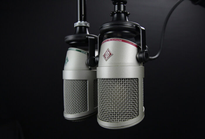 microphones hanging over black background