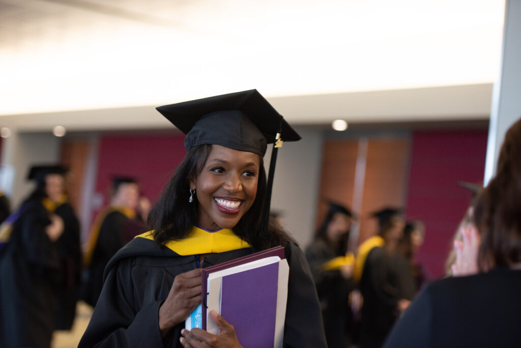 A smiling graduate