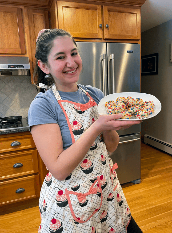 Olivia Strauss holds a plate of cookies