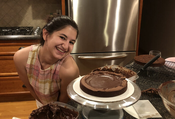 Olivia Strauss smiles by chocolate desserts