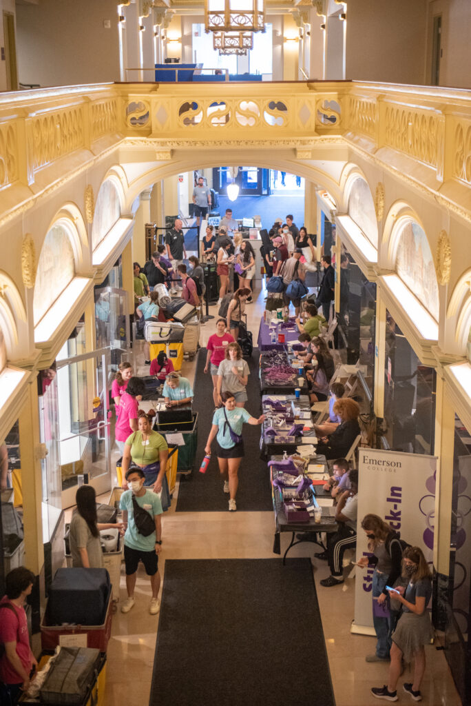 Looking down to the first floor of the Little Building from the second floor. First year students check-in at tables