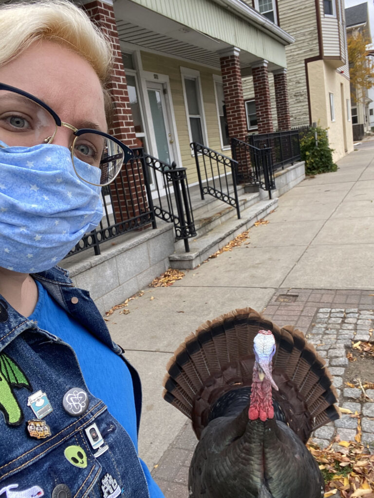 A selfie of a person with a turkey 