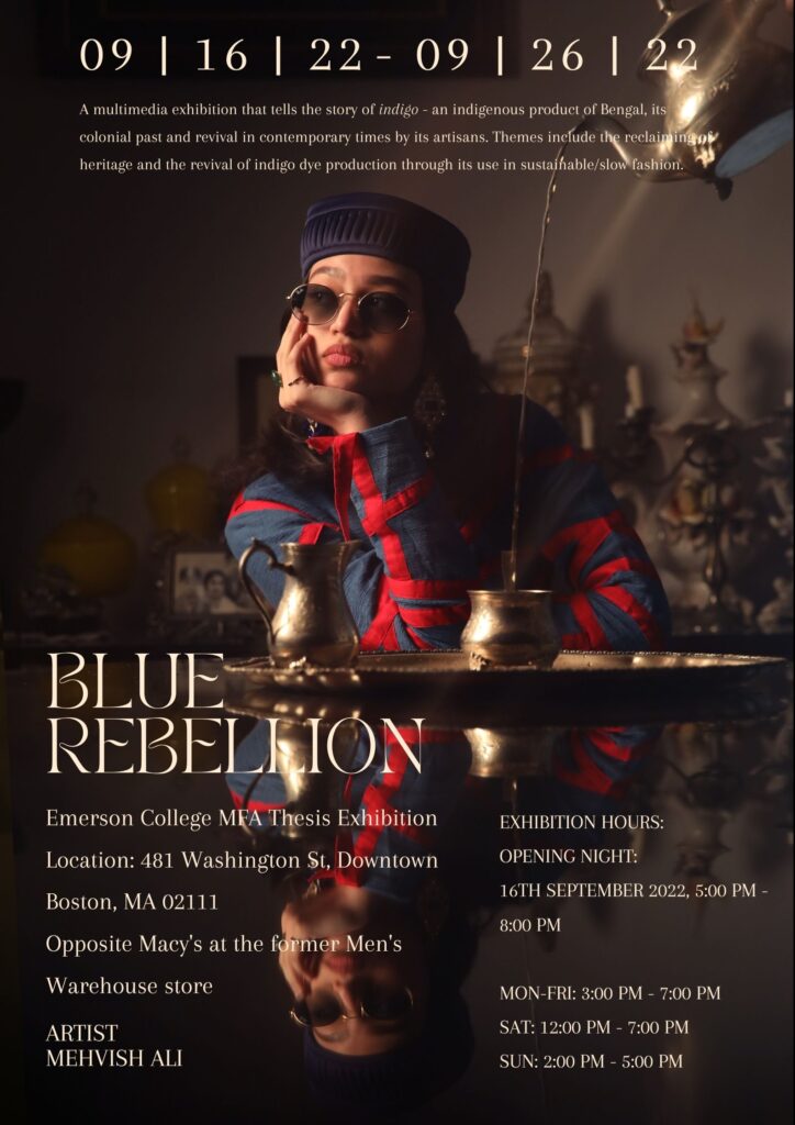 Poster for Blue Rebellion exhibition with woman sitting at table with hand on her face, wearing sunglasses, and blue and red outfit.