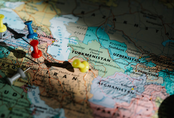 map centered on Iran, with push pins inserted into Iran