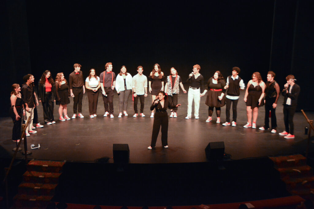A balcony photo of performers on stage