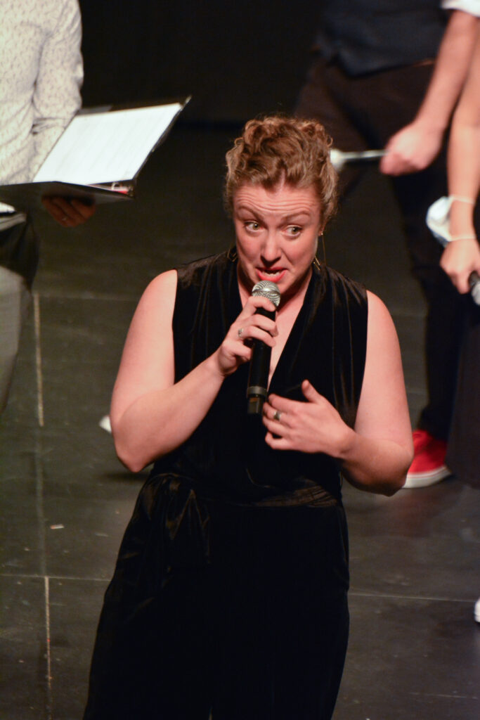A person sings on stage