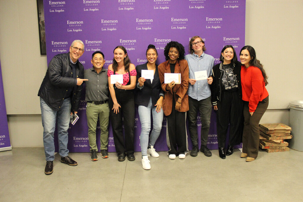 PitchFest winners hold certificates and pose with judges in front of Emerson Los Angeles step and repeat