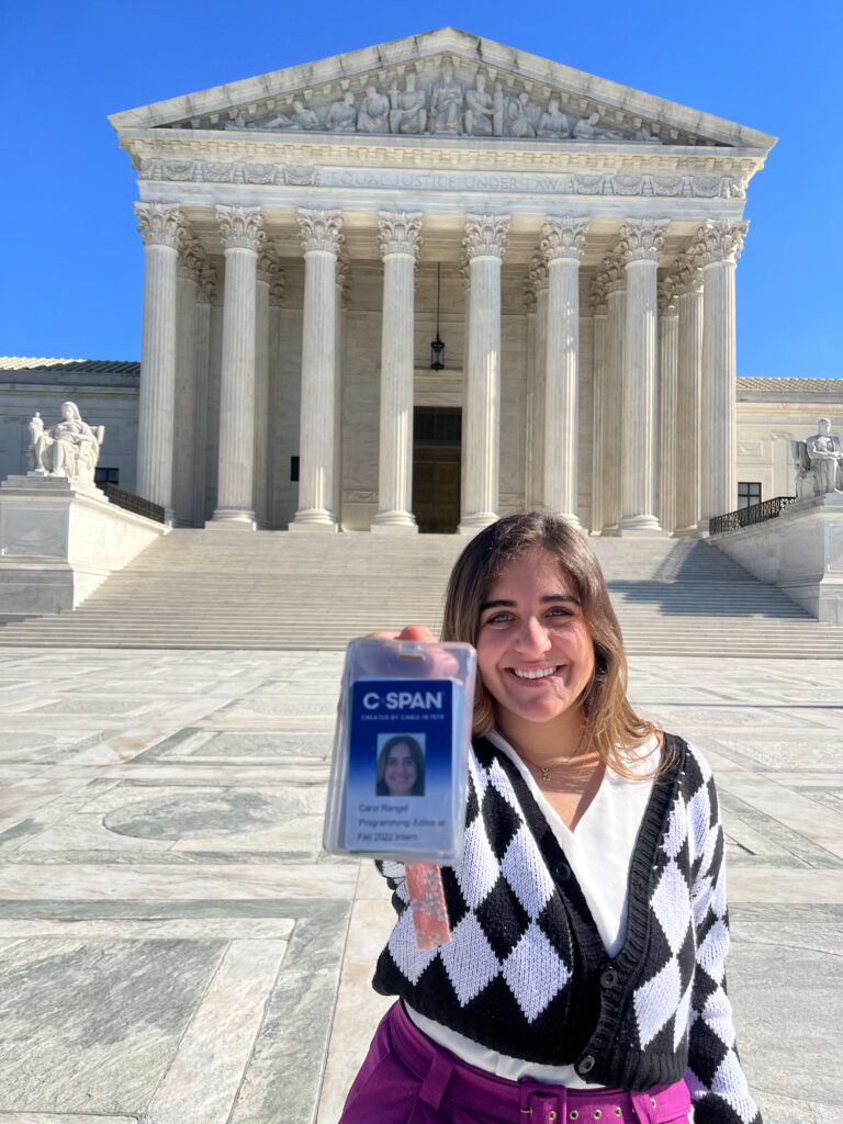 Carol Rangel holds her media pass outside of the U.S. Supreme Court