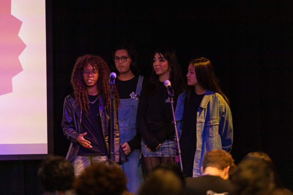 Students speak on stage