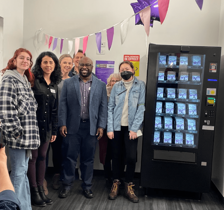 Brandin Dear with staff and students