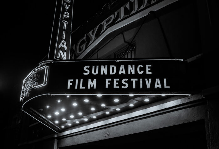 Theater marquis reading Sundance Film Festival at night, black and white photo