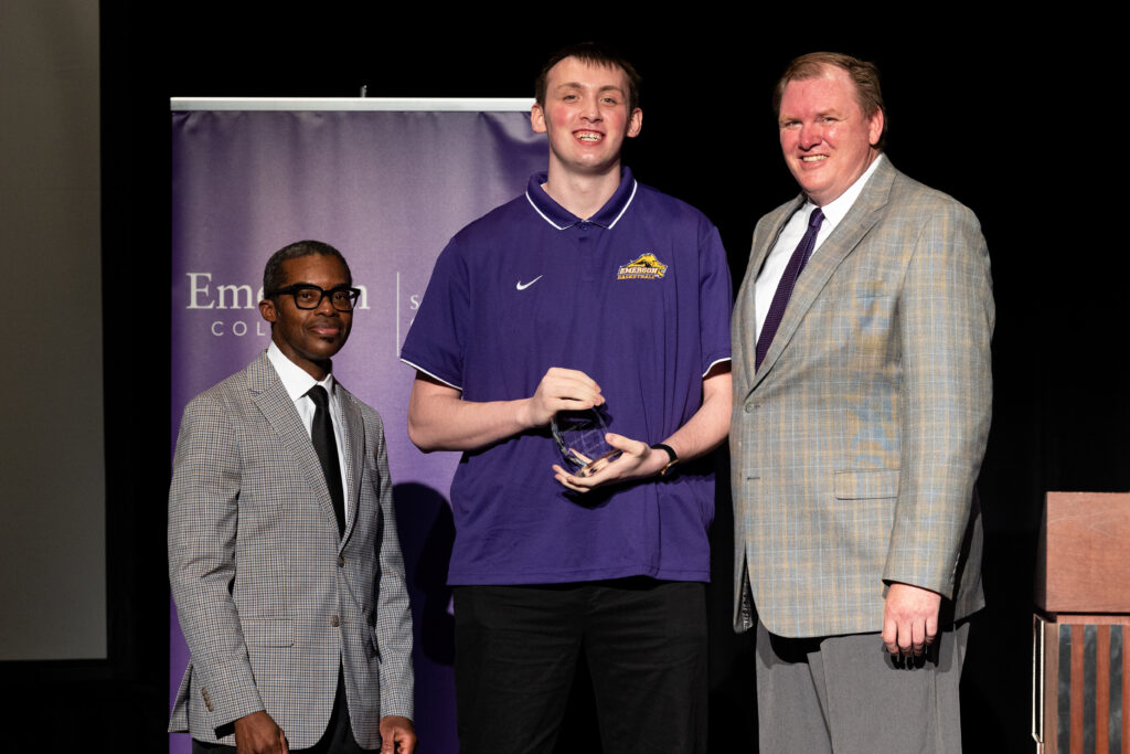 SOC Dean Brent Smith poses next to Jarred Houston ’23 and Bill Curly, Emerson Men's Basketball Coach after Houston received the SOC Award for Student Athlete of the Year. 