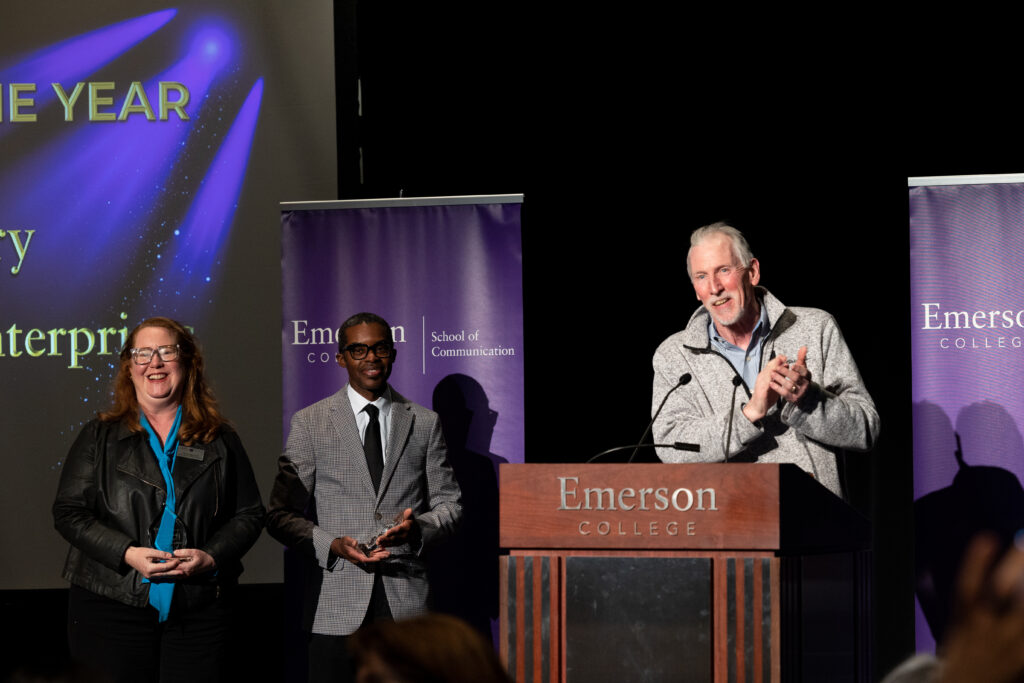 Robert Lyons, BCE  Director, Graduate program and Dean Brent Smith and Cheryl McGrath, Executive Director, Library & Learning at Emerson's Iwasaki Library laugh on stage as they reflect on their partnership.