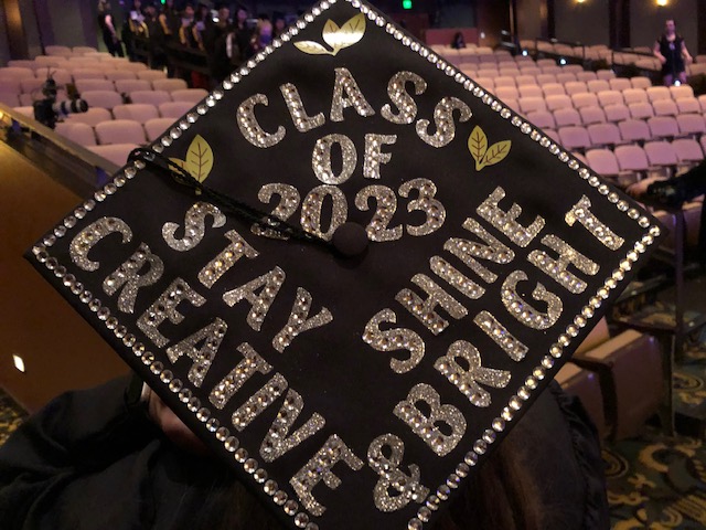 Graduation cap says: Class of 2023, stay creative & shine bright