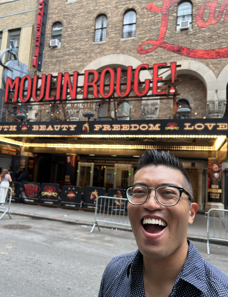 Steven Cuevas outside of Moulin Rouge on Broadway