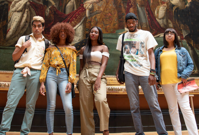 students of color in front of painting in museum