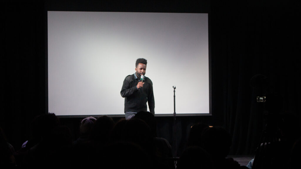 A person performs stand up