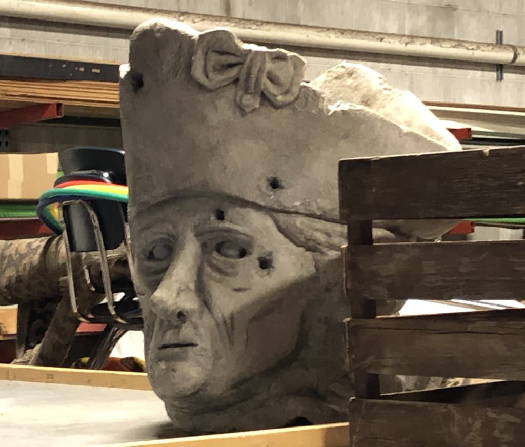A stone-looking sculpture of a head that's actually made from styrofoam