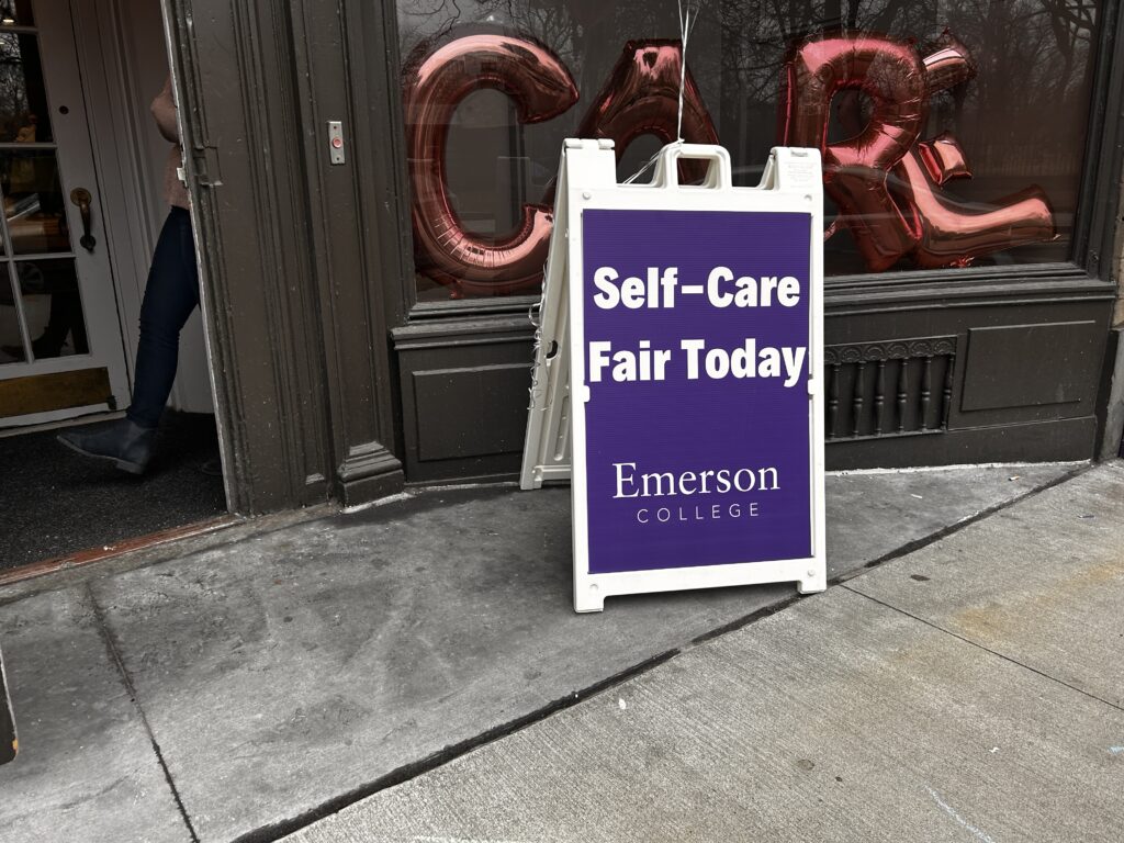 A sandwich sign that says: Self-Care Fair Today