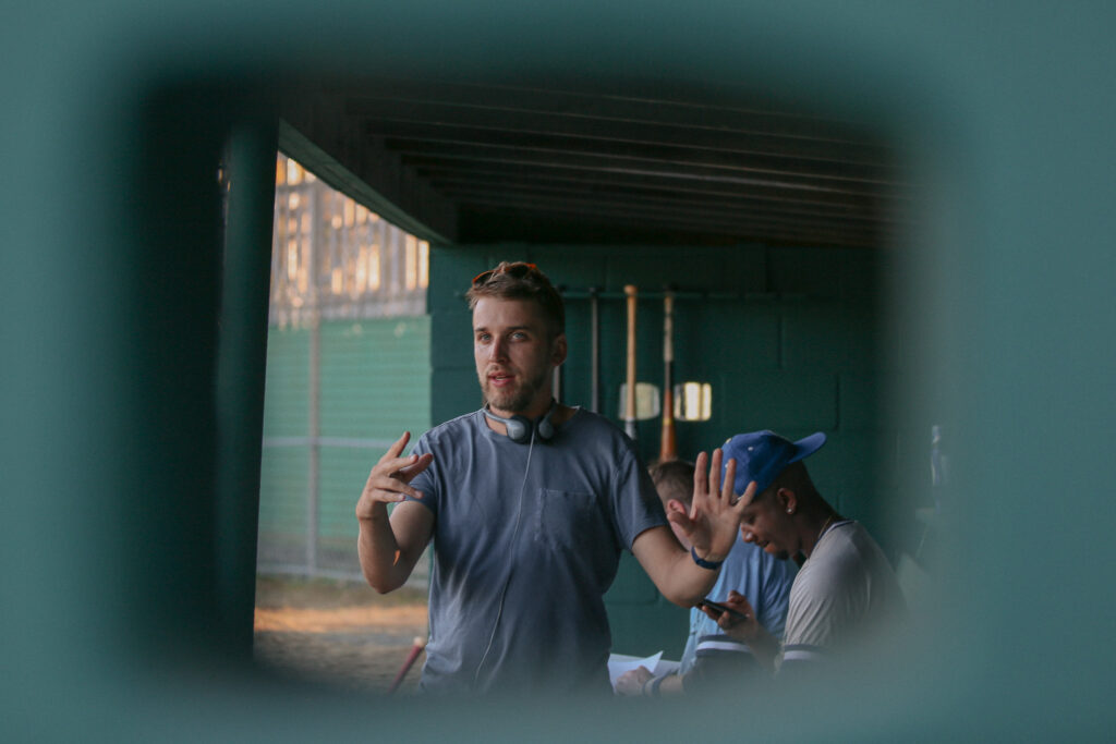 Carson Lund in a baseball dugout 