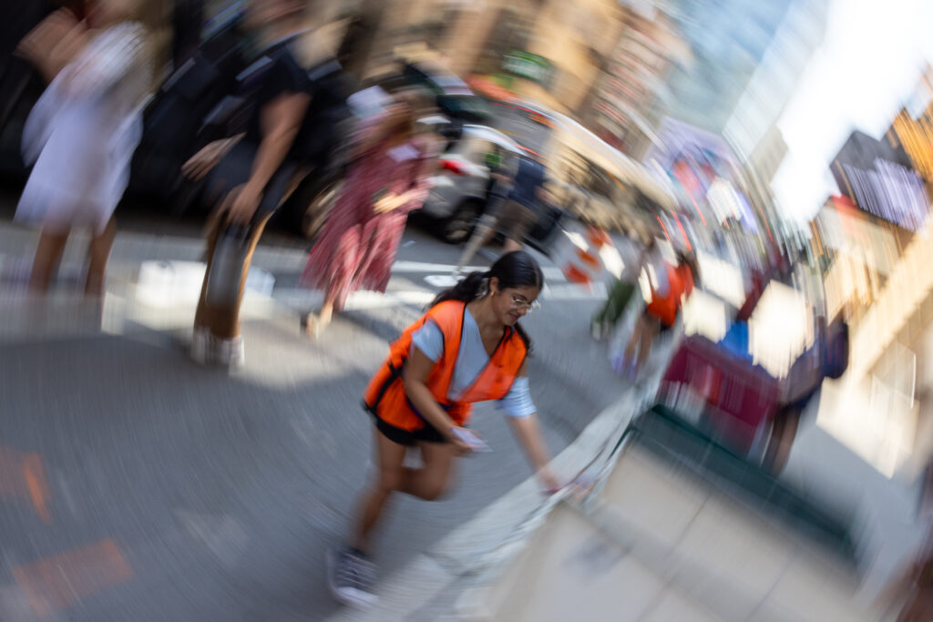 An orientation leader helps someone move in