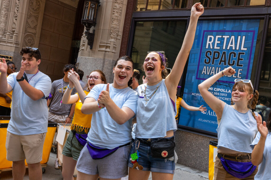 Two orientation leaders cheer