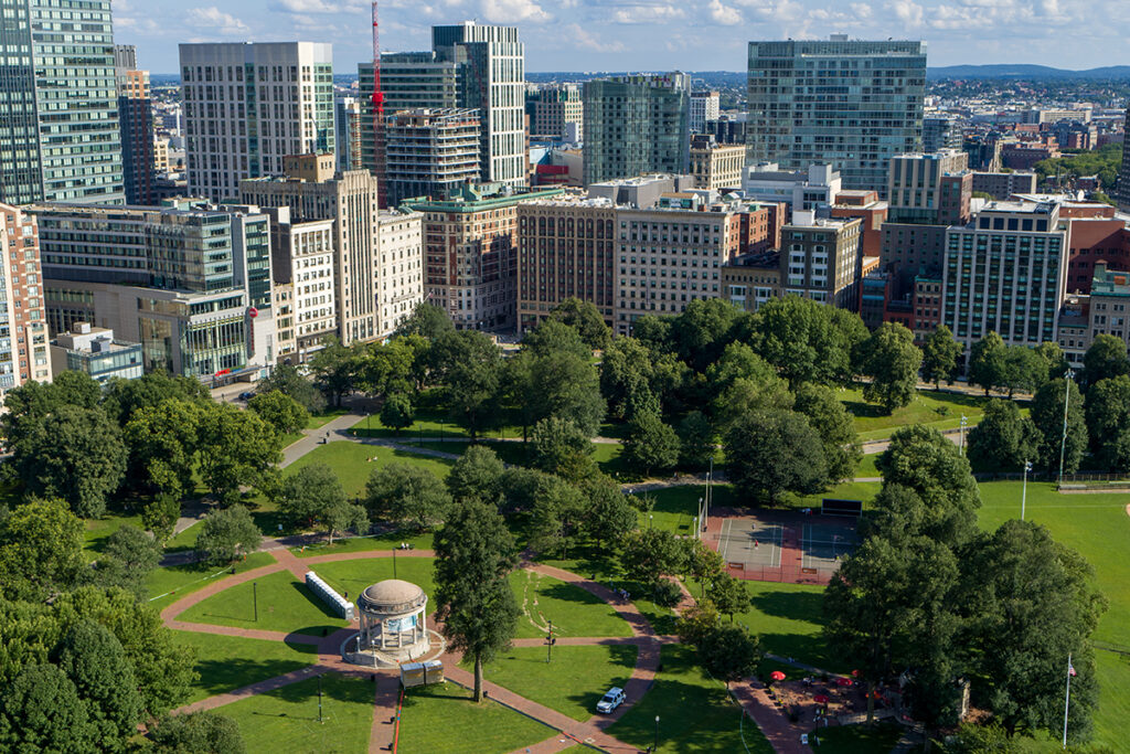 Drone shot of corner of Boylston and Tremont, with Boston Common and Parkman Bandstand in the foreground