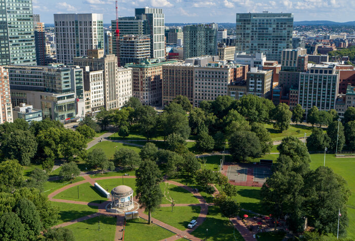 Drone shot of corner of Boylston and Tremont, with Boston Common and Parkman Bandstand in the foreground