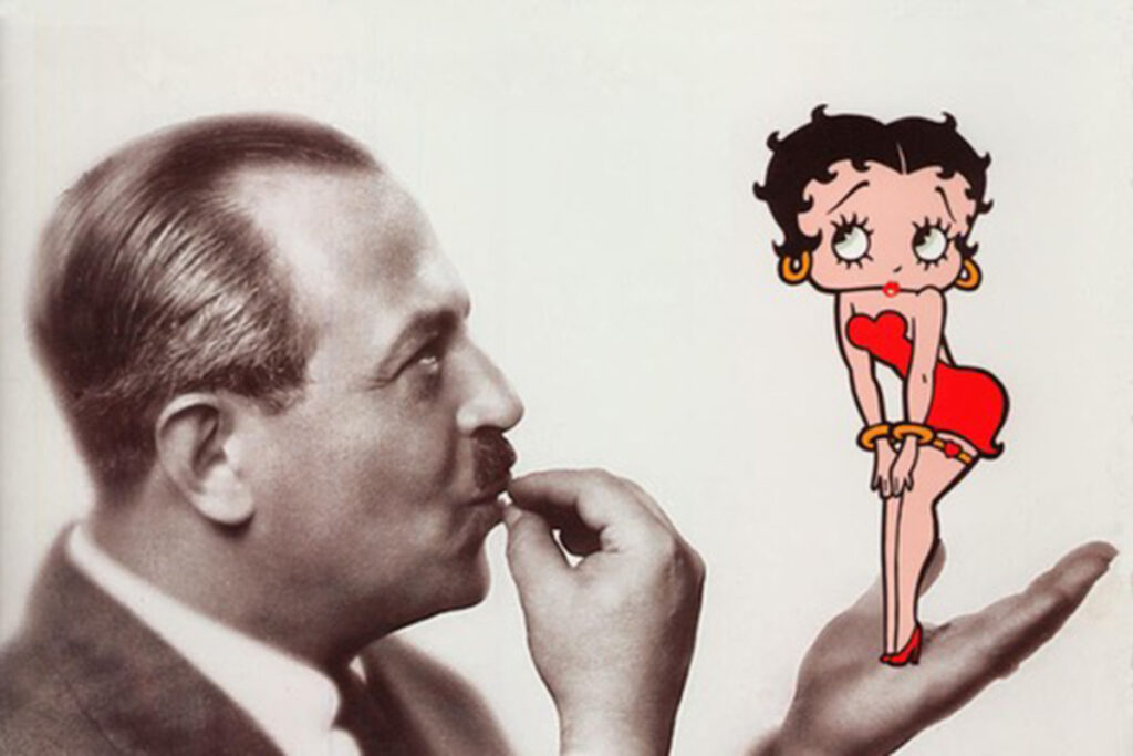 An animated woman wearing a short black bob and red dress stands in the hand of a man, rendered in black and white, wearing a suit and tie and slicked back hair