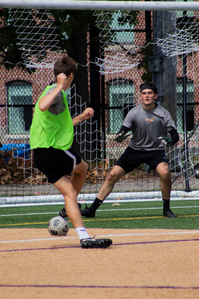 A player shoots on a goalie