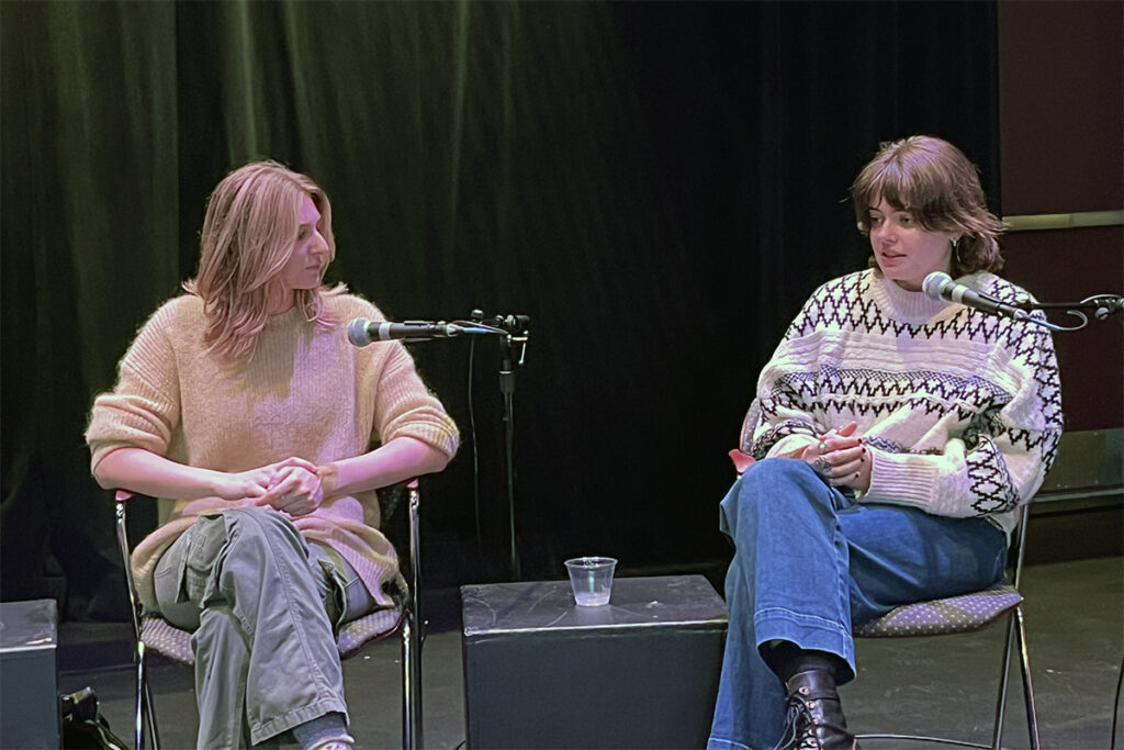 Sydney Schiller and Lara Brinkman speak on stage